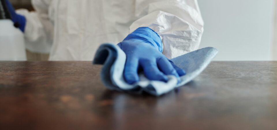 Wiping and disinfecting a table
